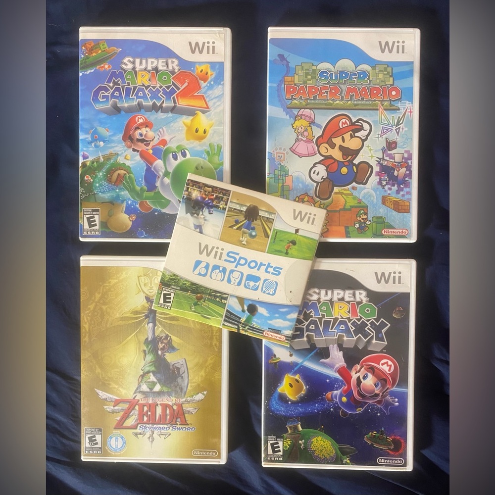 5 wii games / paper mario, zelda skyward sword, mario galaxy 1 and 2, wii sports